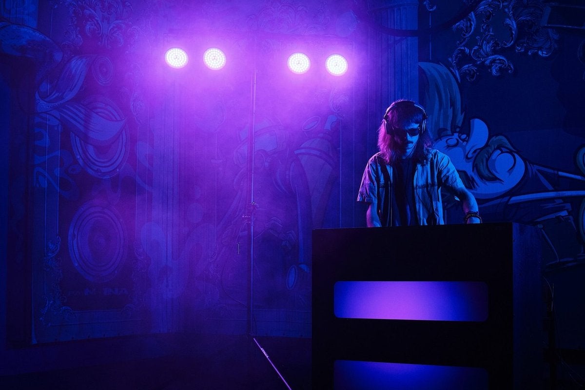 DJ in purple light from Ayra ComPar 2 LED spots